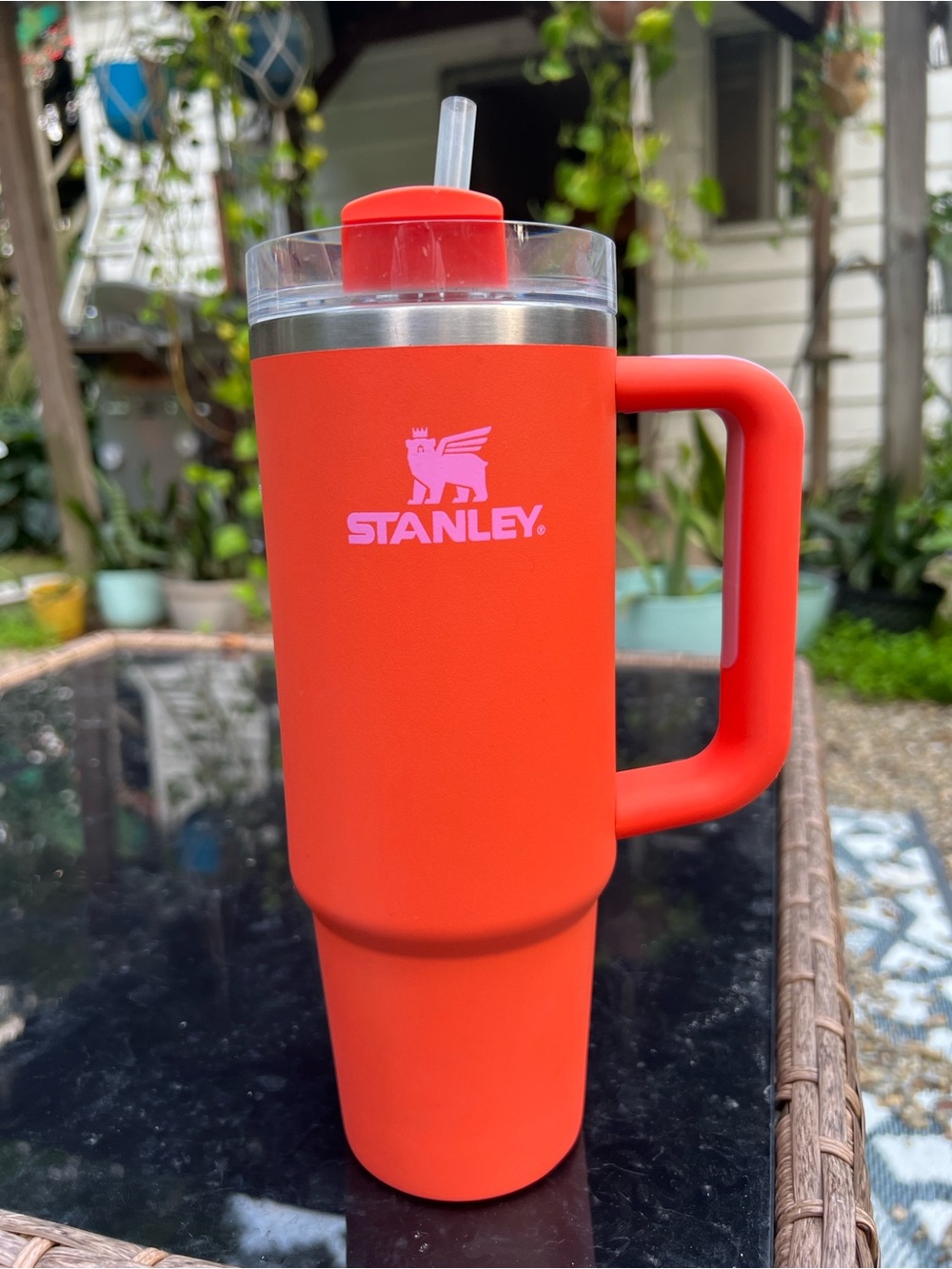 Bright orange with pink Stanley 30oz